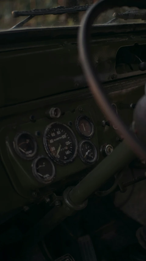 an old car dashboard with the gauges and air meter