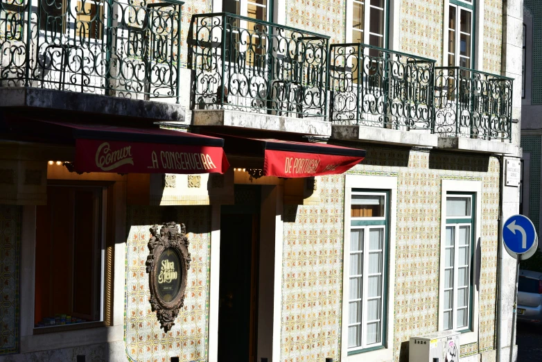 a building with the name of an establishment and balconies