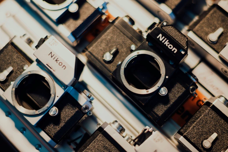 several vintage cameras sitting next to each other on display