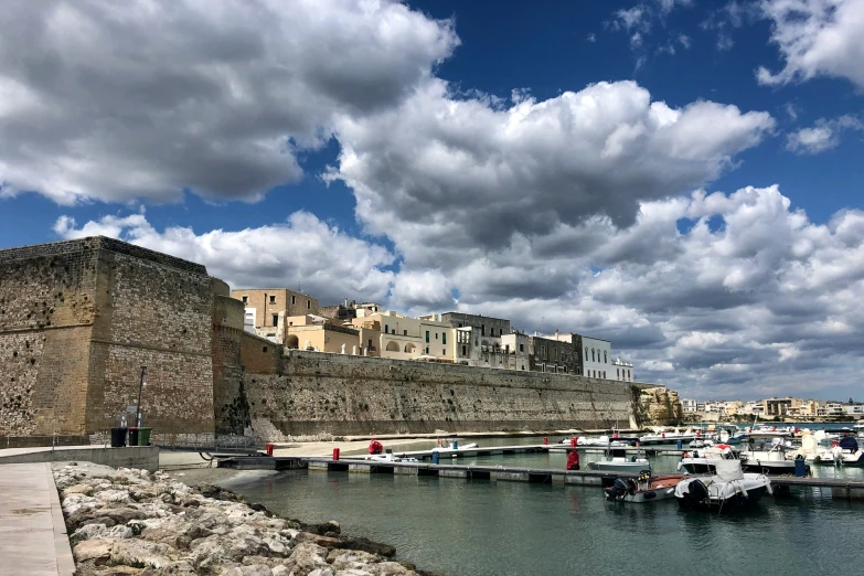 there are many small boats that are docked on the water