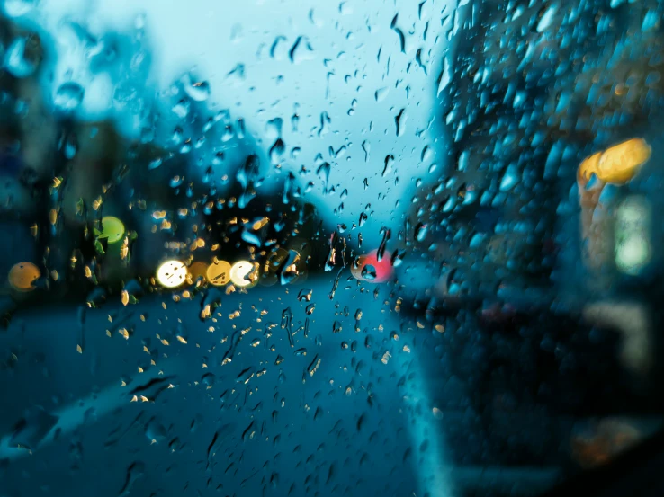 a rain covered window on a rainy day