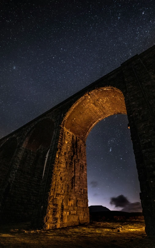 the night sky is illuminated by stars in the background