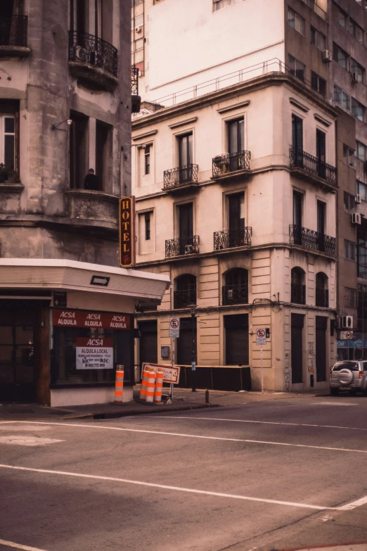 an empty street is shown with construction cones