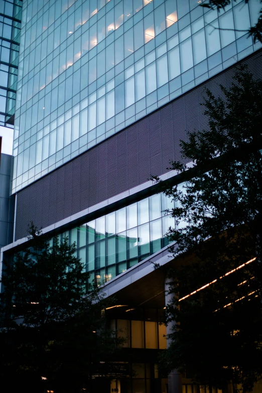 a building with a lot of windows and a clock in the window