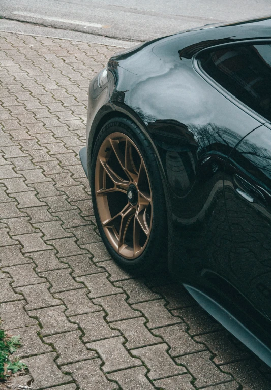 a black car parked in a parking lot