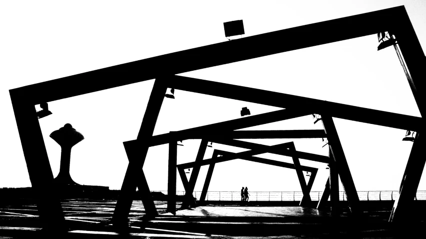 an image of a man walking on a bridge