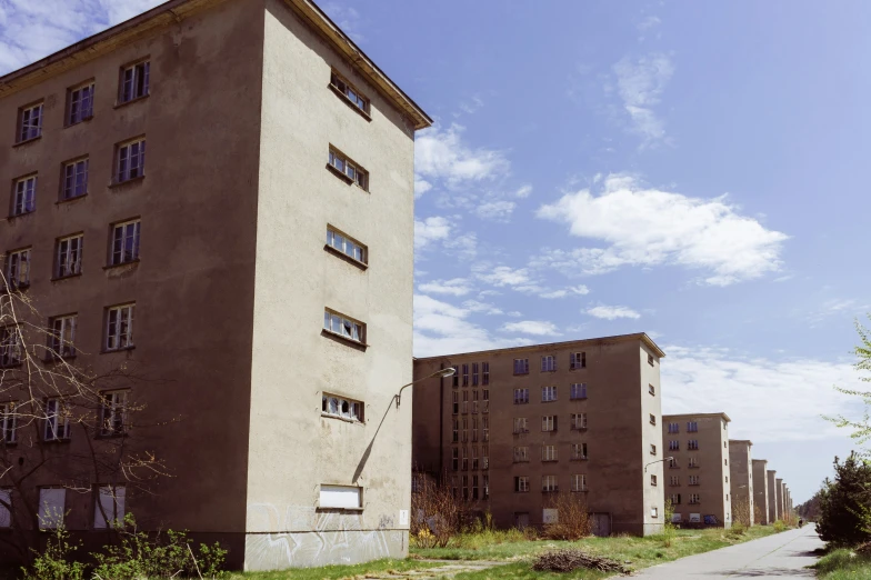 the backside of a building near an empty path