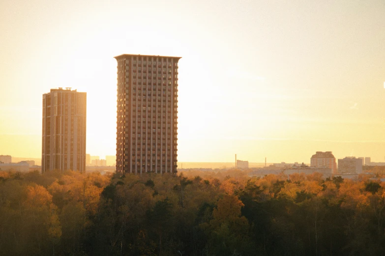 three tall buildings in a city setting