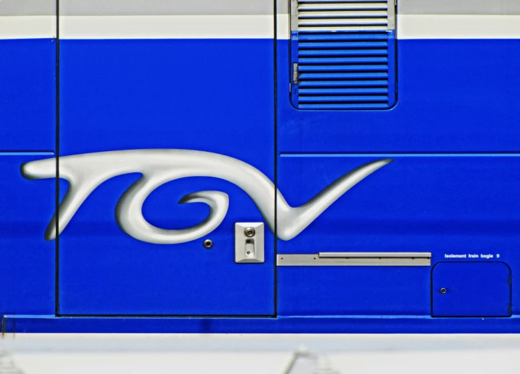 the back end of an rv with a white wave painted on it