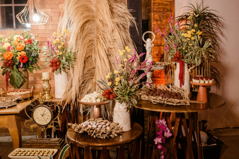 an arrangement of flowers and other assorted things on tables