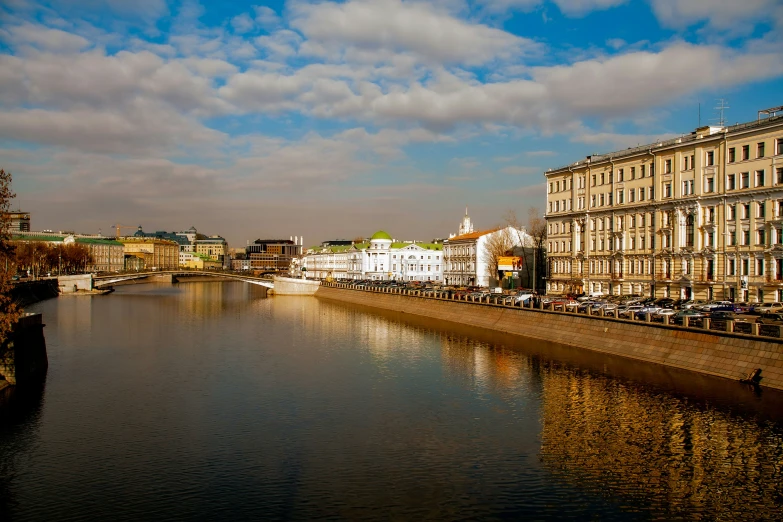 some buildings on a river and some water