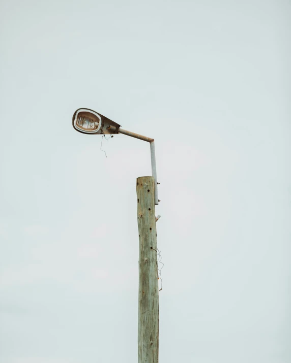 a light up pole has graffiti on it