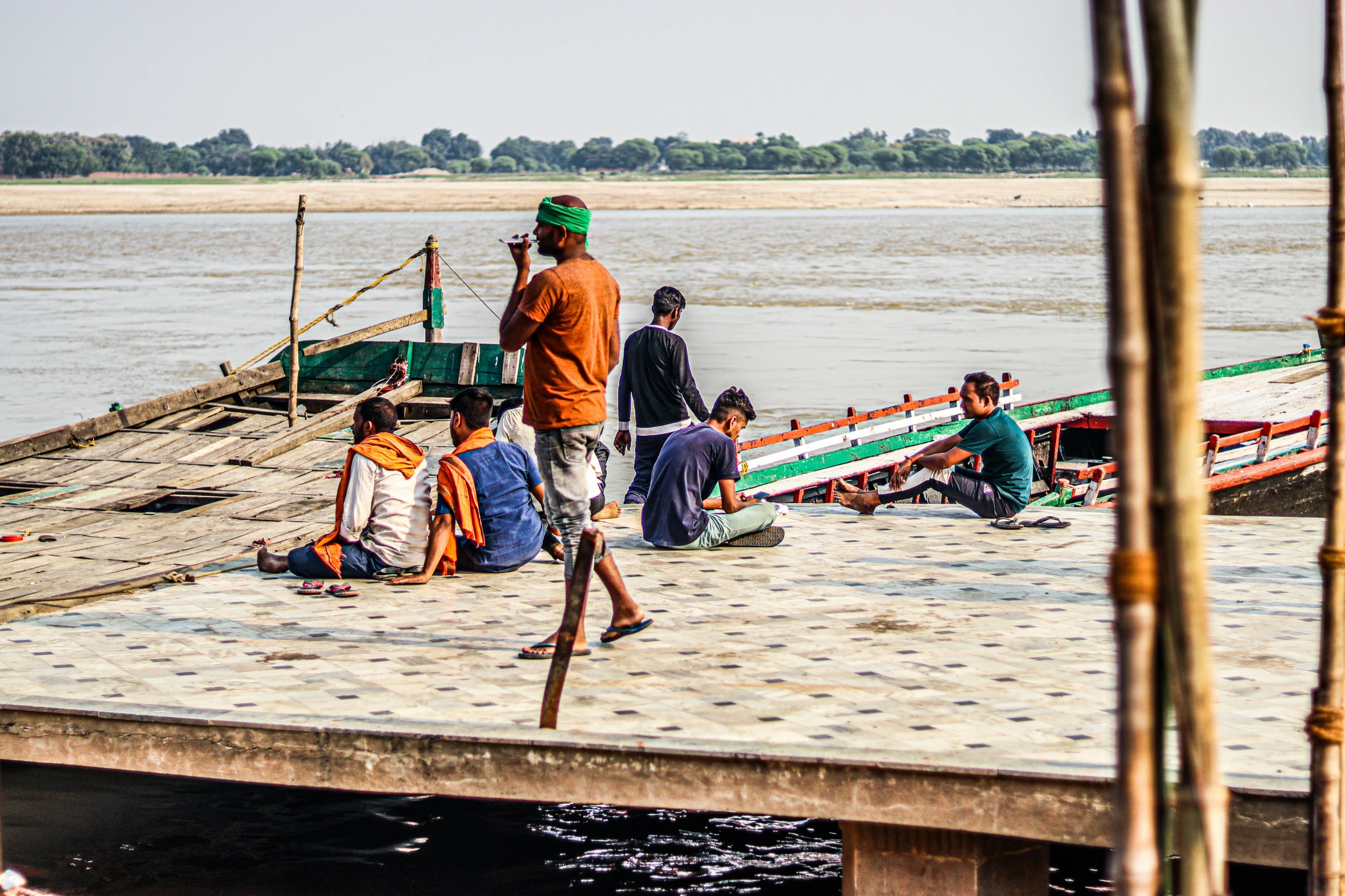 a group of people are on the dock