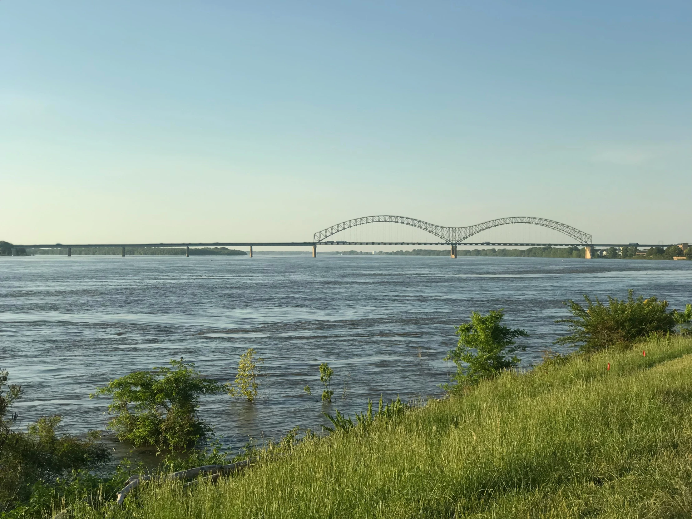 a bridge spans over a wide body of water