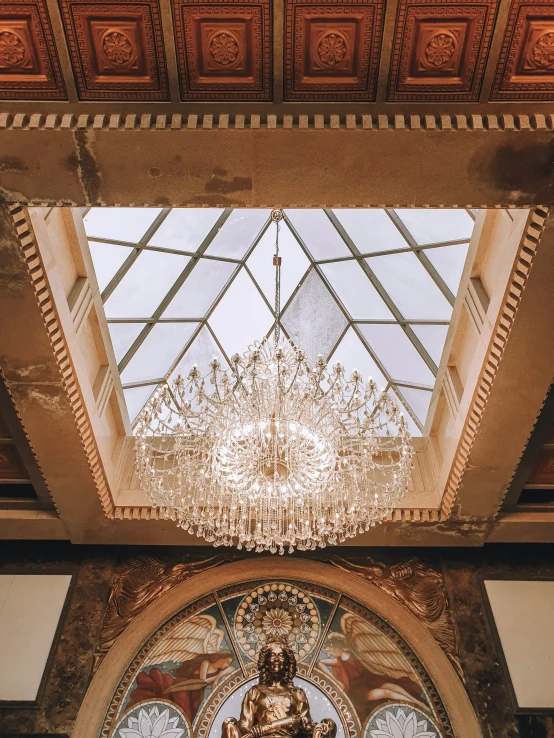 an ornately painted room with ornate glass and a chandelier