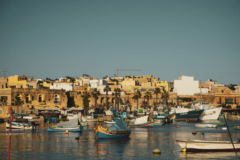 a boat harbor in front of an island