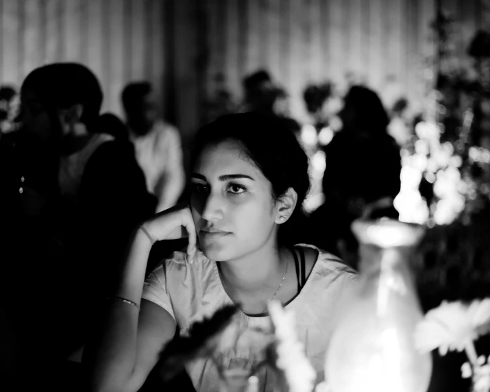 black and white image of a person with a candle