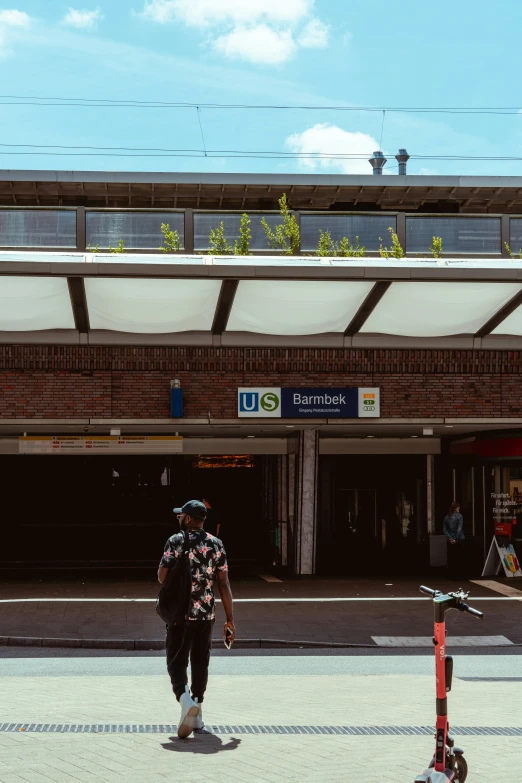 a person walks down a walkway by an airport