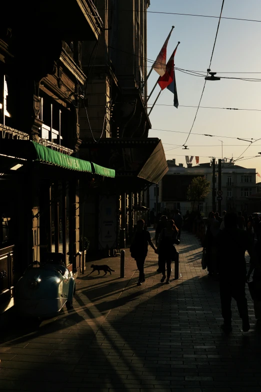 a street filled with people walking down it