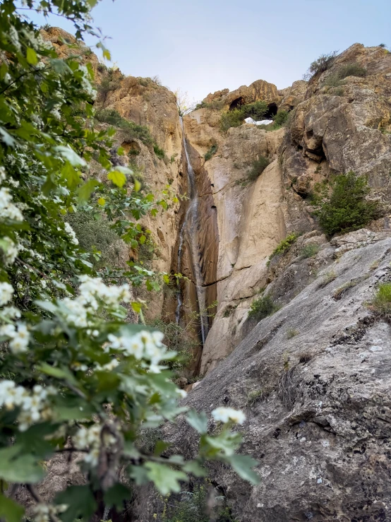 there is a steep side of a rock cliff