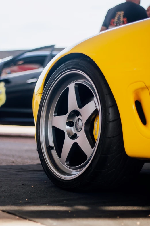 a close up view of the rims of a sports car