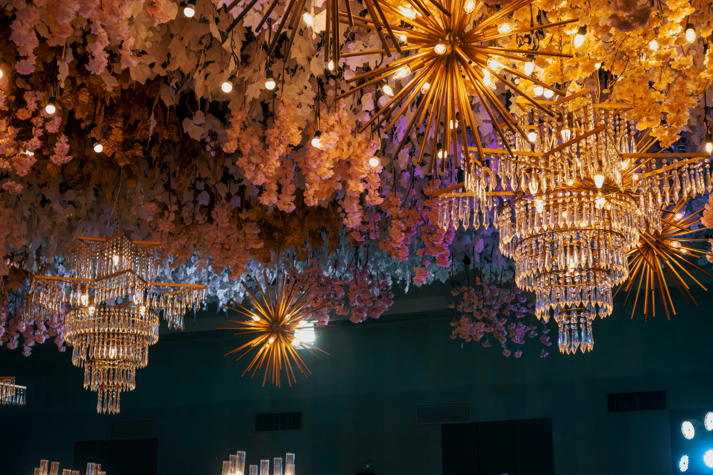 many chandeliers hang from the ceiling in a building