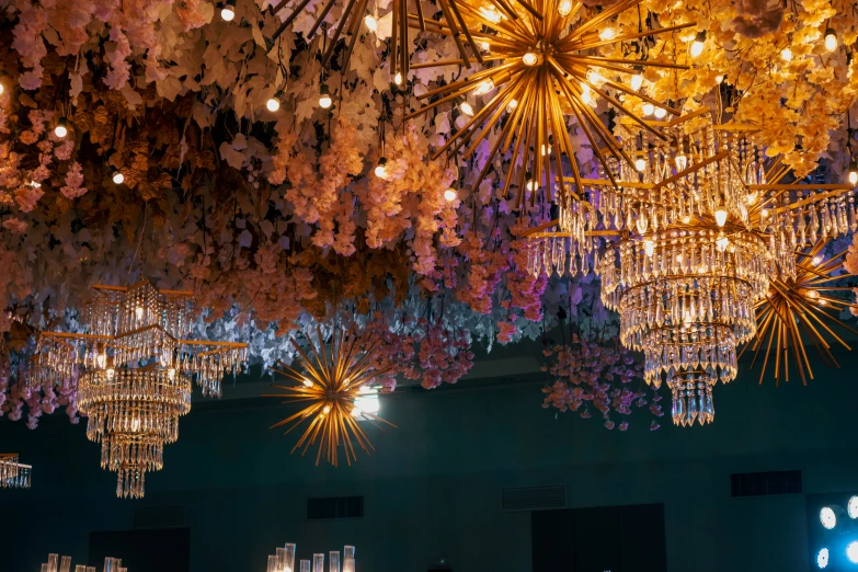 many chandeliers hang from the ceiling in a building