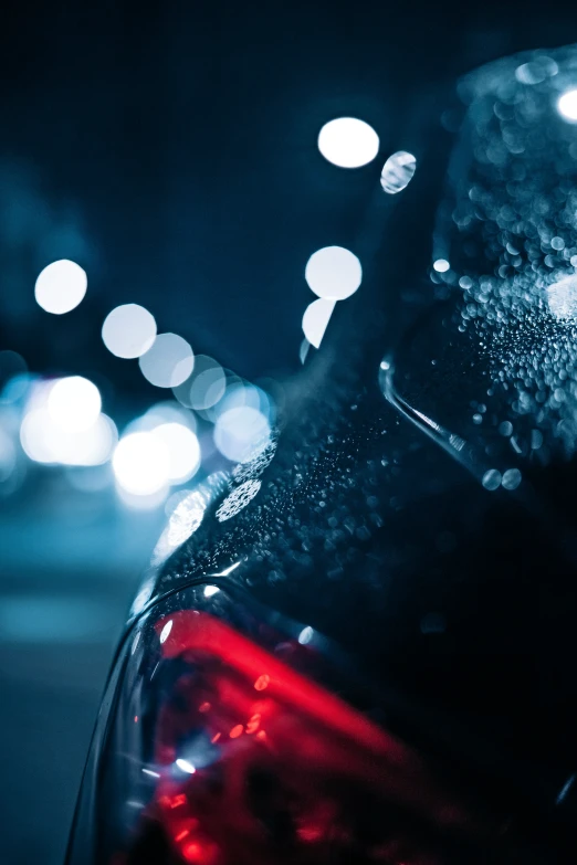 the top part of a vehicle with some lights in the background