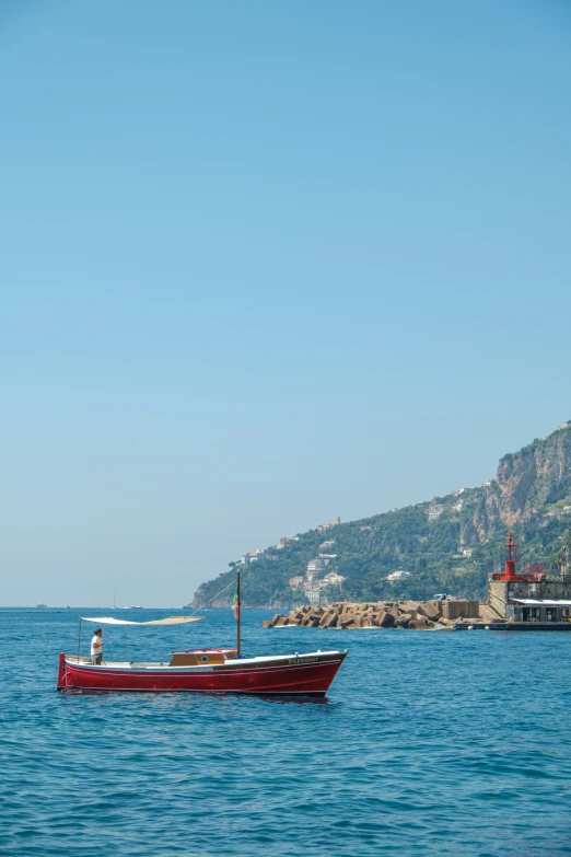 an empty boat floats out into the open ocean