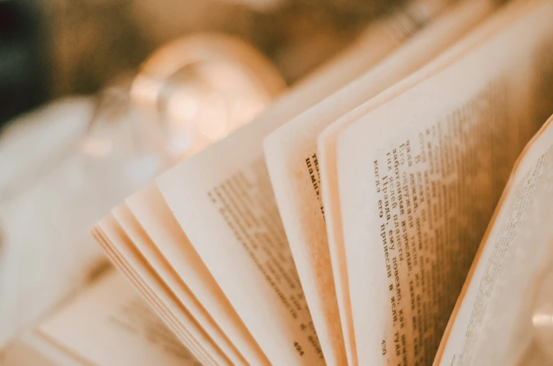 a book is open and lying on the table