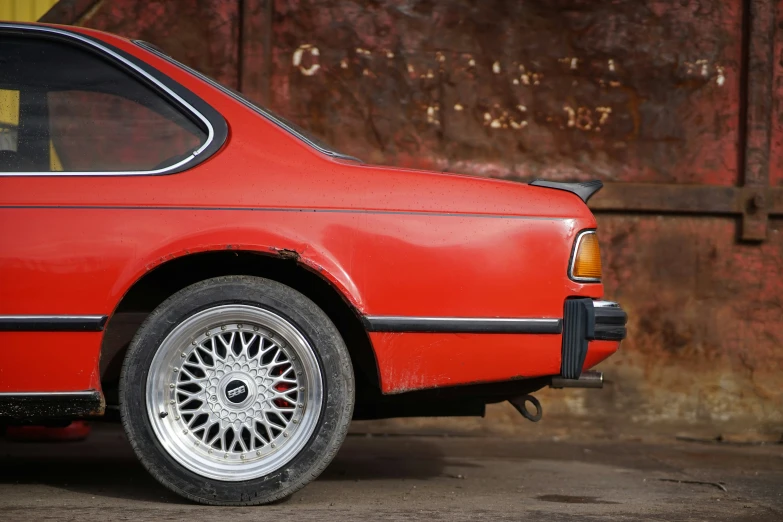 a car that is red with chrome rims