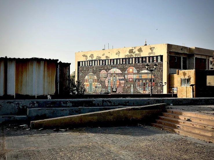 an old building with various designs on it's side