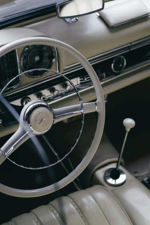 inside view of old silver and black car interior