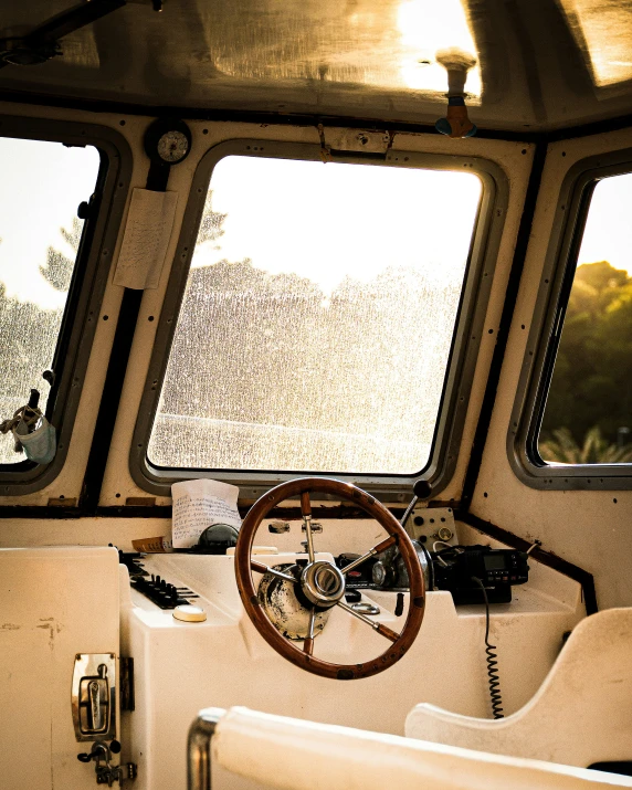 the steering wheel and dashboard on a boat