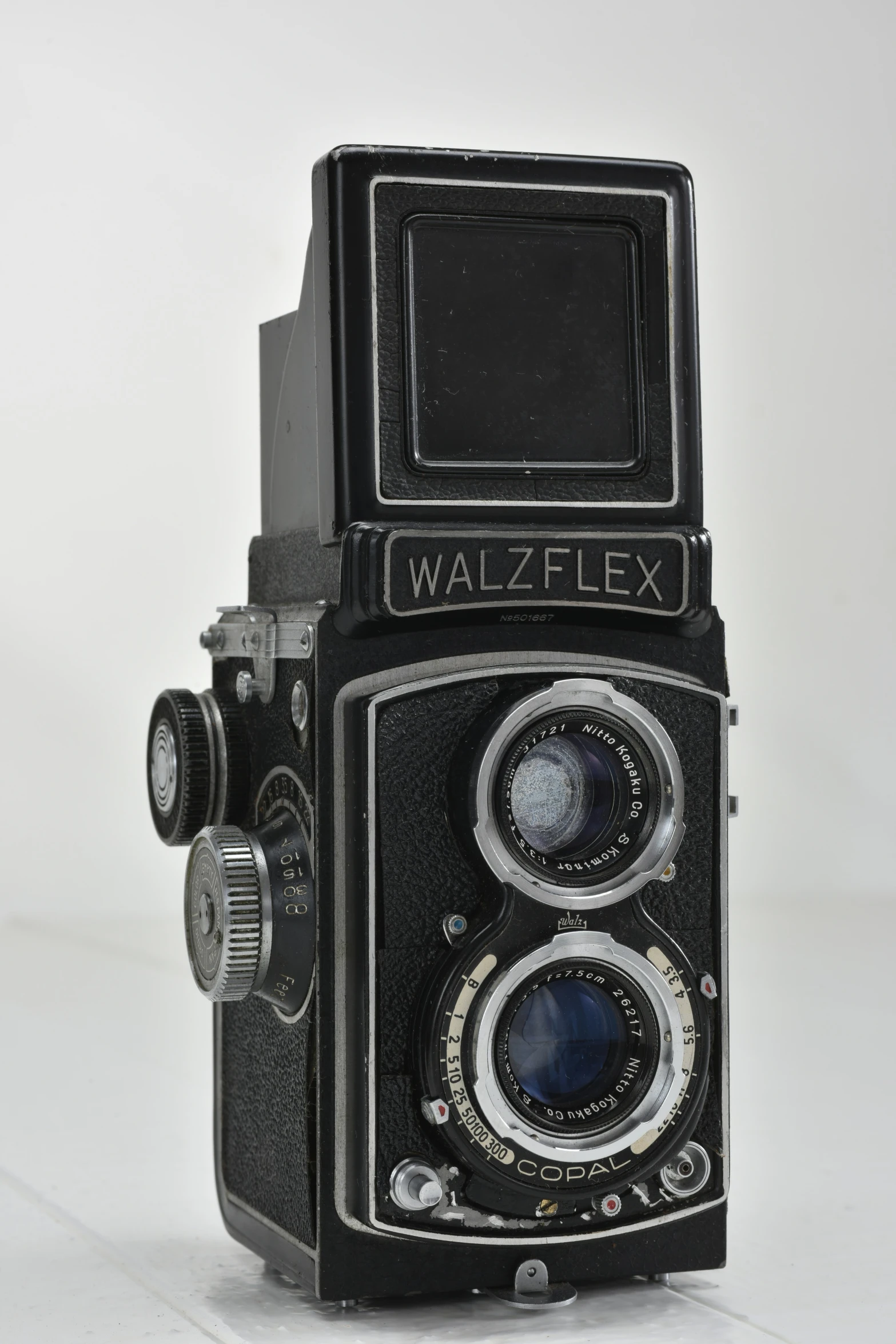 an antique black and white walbeex camera