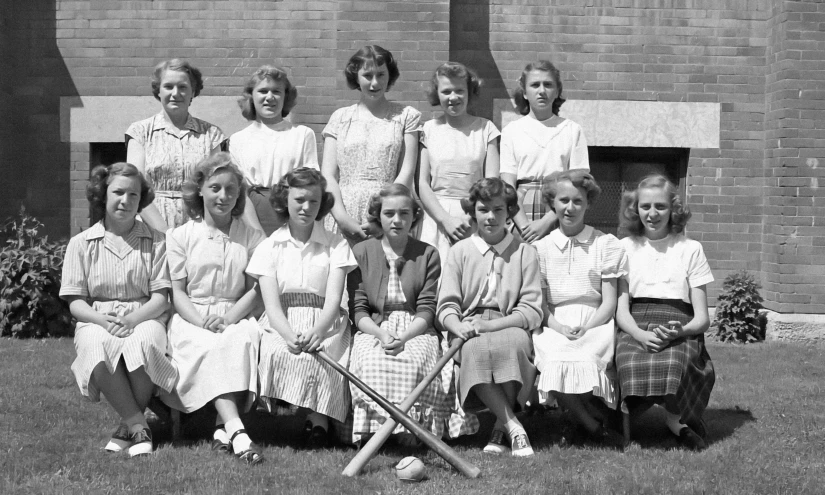 an old po of girls in dresses and a baseball bat