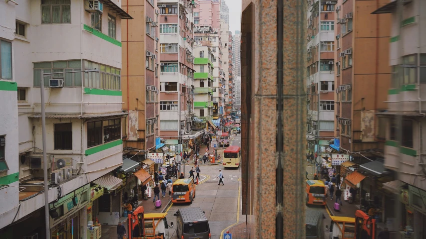 a street with buses in a very busy place