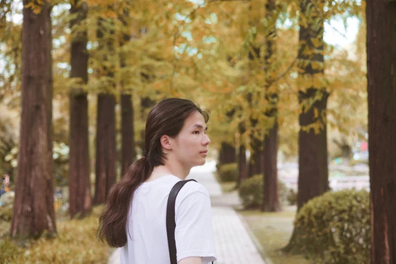 young woman walking down street in city area