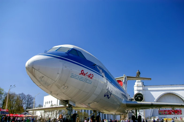 the giant plane is in front of a building