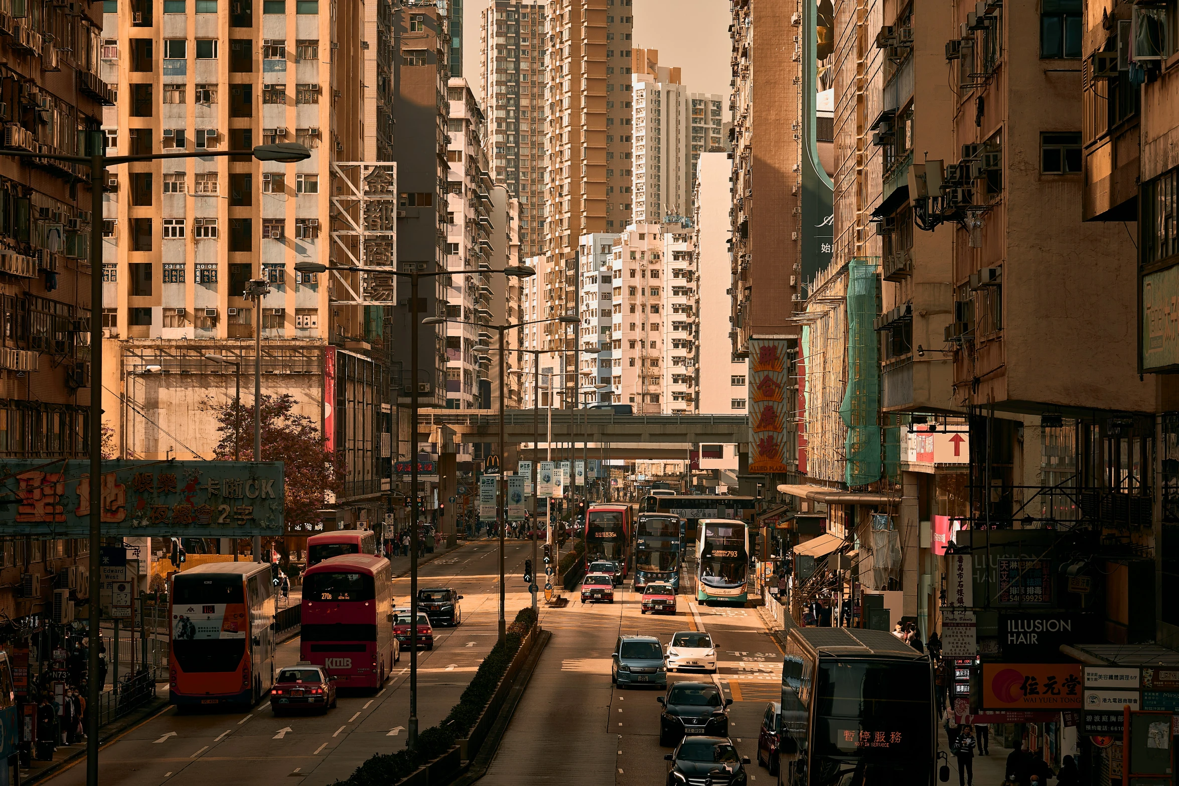 the city is busy with double decker buses and traffic