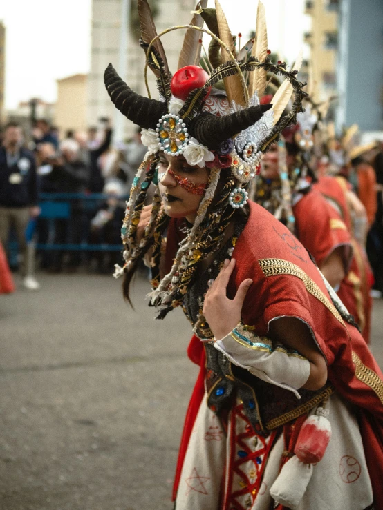 the men are in costume with long horns