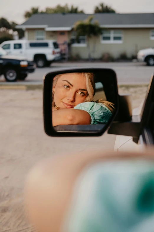 a woman that is taking a picture in a mirror