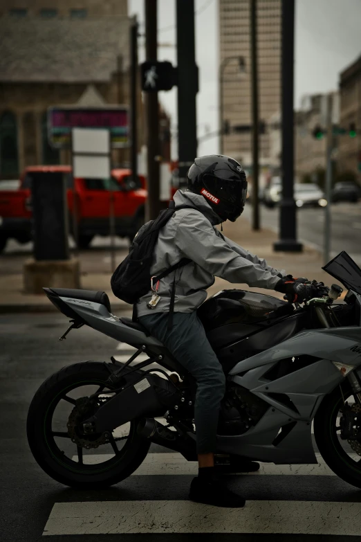 a motorcycle is driving in the street on the pavement