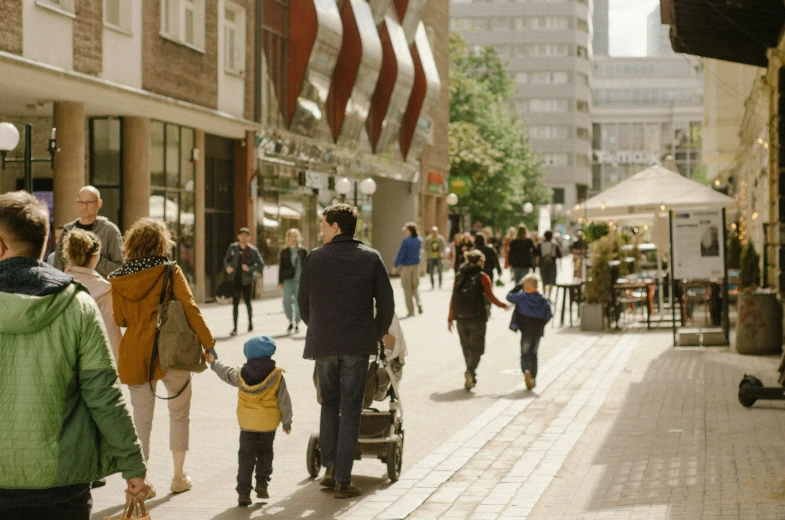 a group of people walking down a street