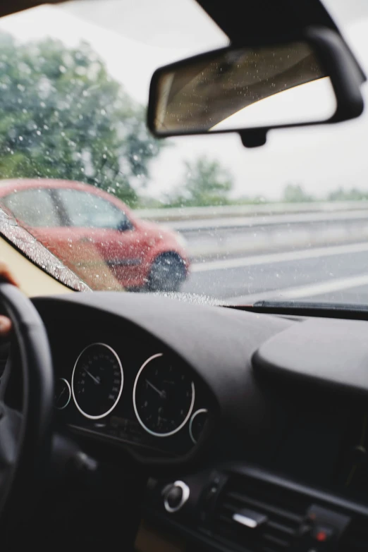 a picture of a red car from inside