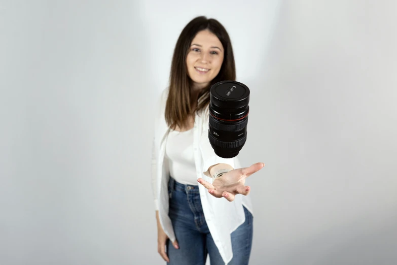 a lady that is holding some kind of object