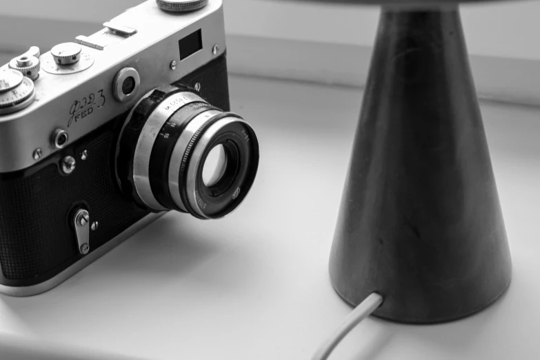 a vintage camera is attached to a table