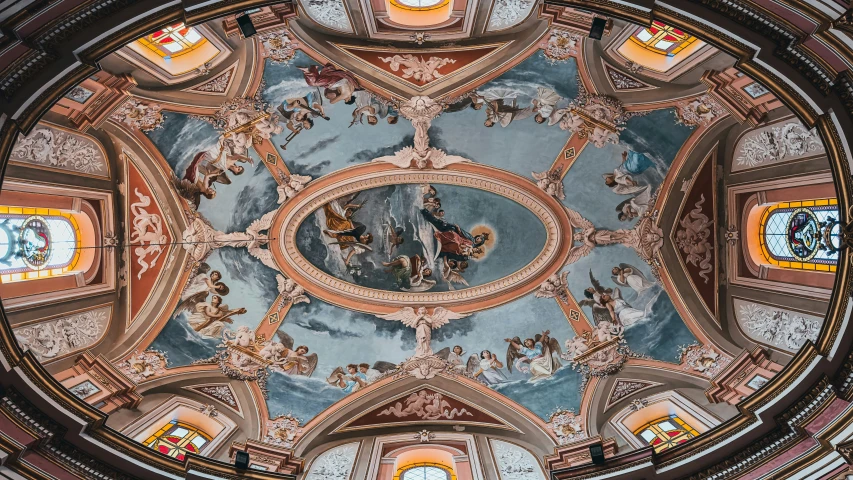 view from the floor up looking up at a dome with some ceiling painted