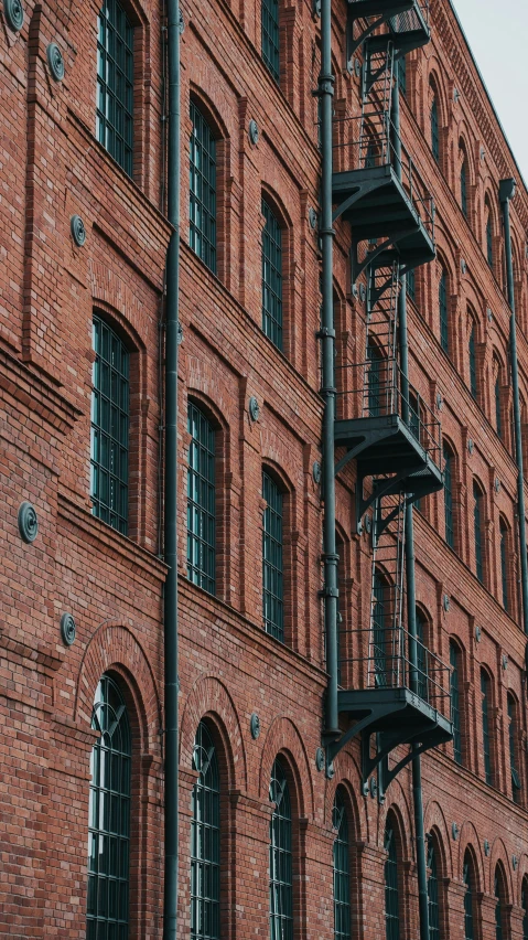an old brick building with iron balconies