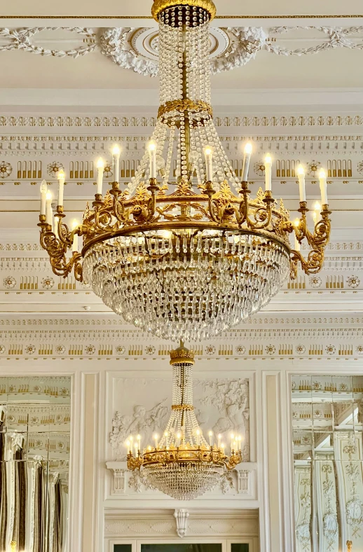 a chandelier hanging in a room with white walls